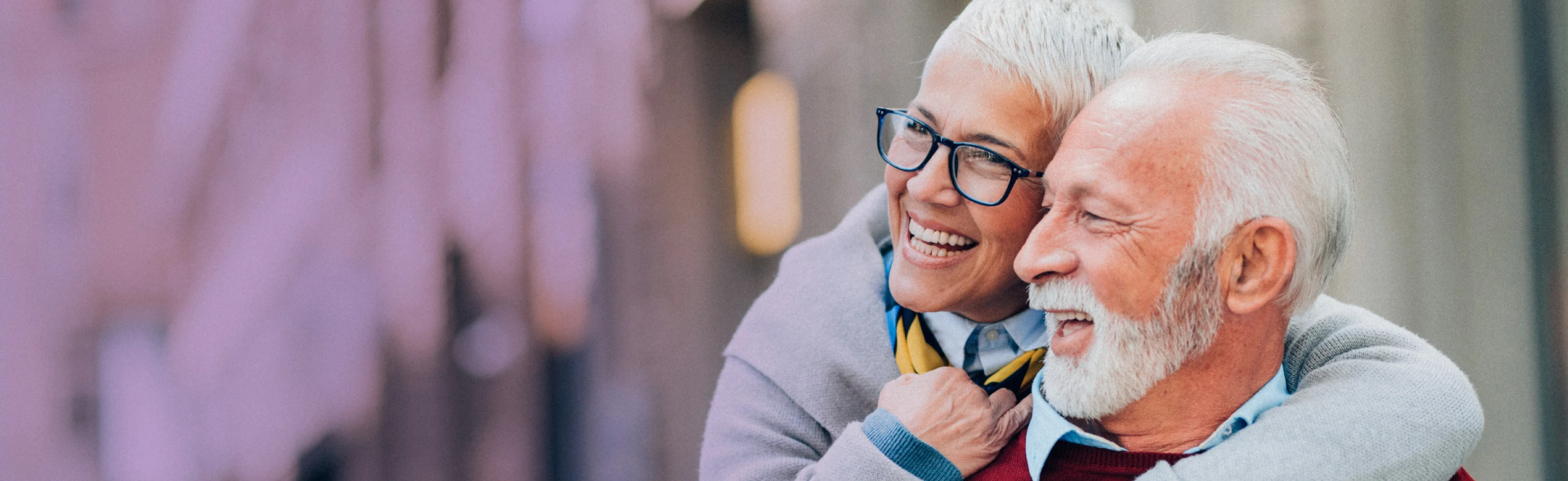 elderly talks on mobile phone and smiles